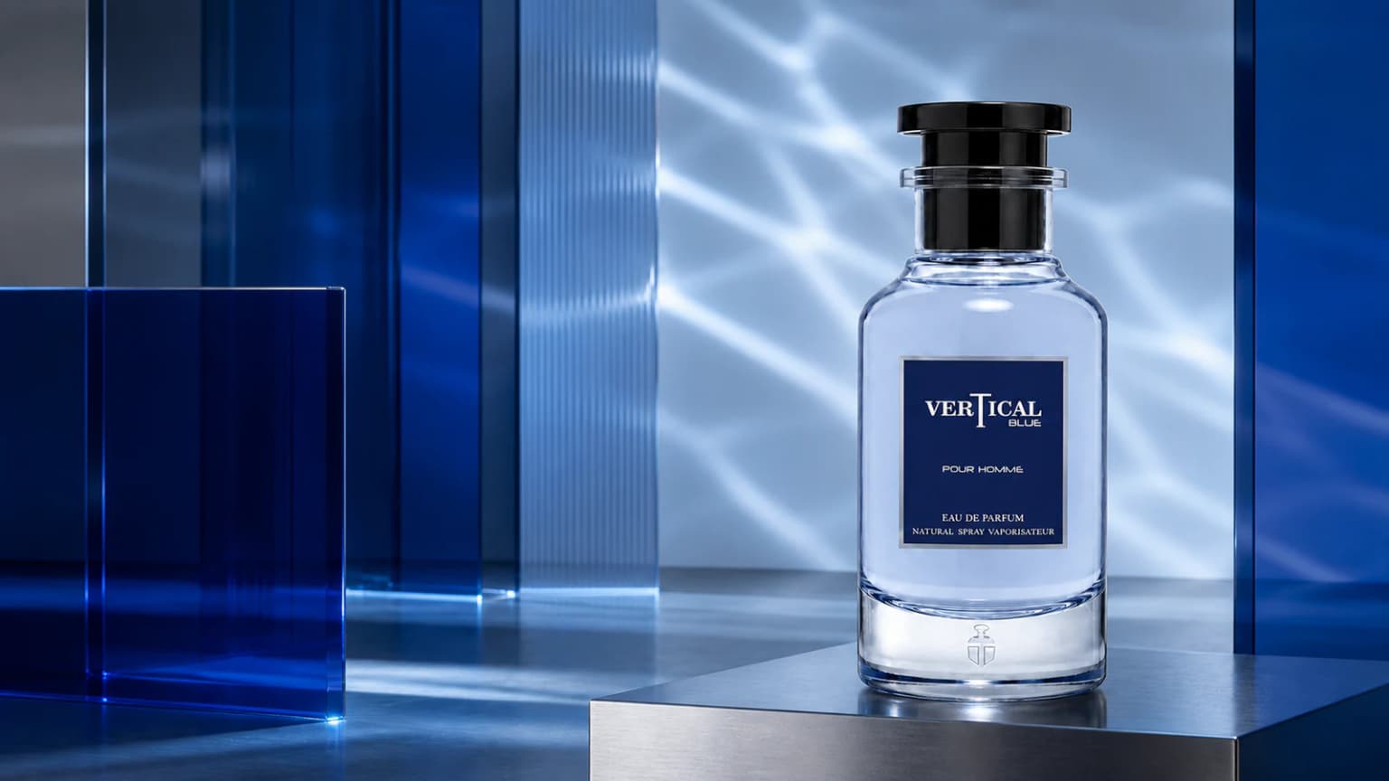 Vertical Blue Pour Homme perfume bottle in a cobalt glass and steel studio